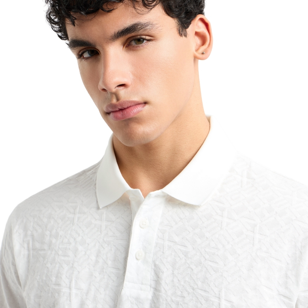 Polo Armani Exchange regular fit con logo all over torno su tono