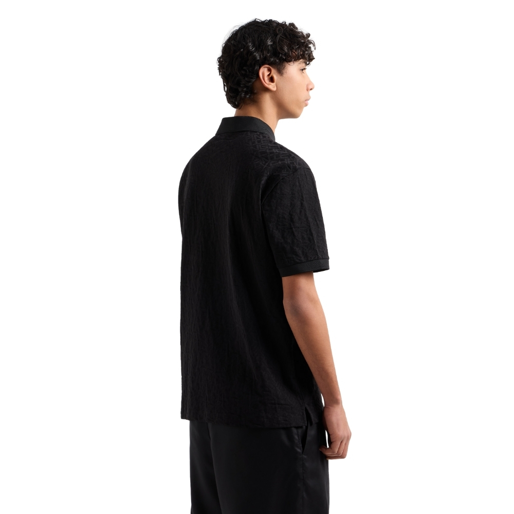 Polo Armani Exchange regular fit con logo all over torno su tono