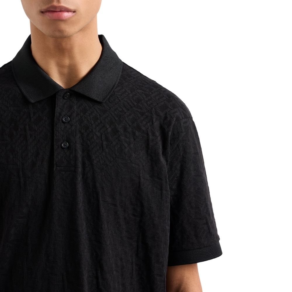 Polo Armani Exchange regular fit con logo all over torno su tono